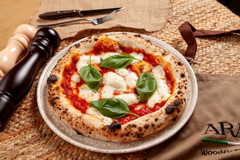 pizza luce Classic Margherita pizza with fresh basil and mozzarella