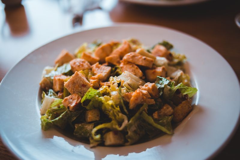 Caesar salad with croutons and parmesan at Pizza luce